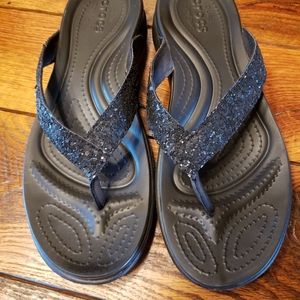 Crocs black flip flops